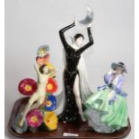 A Wedgwood figure 'Queen of The Night'; Carlton Ware figure; and Royal Doulton 'Top O The Hill'