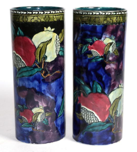 A pair of Hancock & Sons pottery, lustre decorated ''Rubens Ware'' sleeve vases