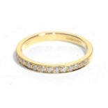 An 18 carat gold diamond half hoop ring, total estimated diamond weight 0.30 carat approximately,