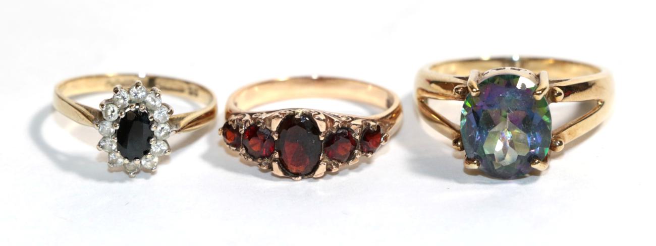 Three various 9 carat gold gem set rings, finger sizes O1/2, P and S1/2. Gross weight - 11.12 grams.