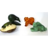 An amber elephant and three other items