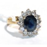 An 18 carat gold sapphire and diamond cluster ring, finger size J . Gross weight - 3.79 grams.