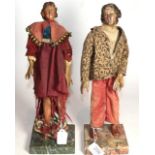 A pair of carved polychromed wooden figures of Gentlemen, possibly Naples, 19th century, one wearing