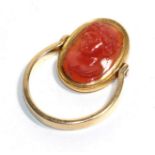 A carved carnelian cameo mounted swivel ring, carved in high relief depicting the bust of Bacchus,