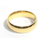 An 18 carat gold band ring, finger size V. Gross weight - 10.49 grams.