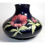 A Moorcroft pottery Anemone pattern vase, painted and impressed marks, also gold signature for