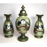 A Victorian painted opaque glass garniture decorated with magpies