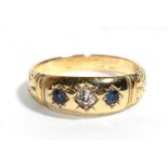 A late Victorian/Edwardian diamond and sapphire three stone ring, finger size O. Marks rubbed. Gross