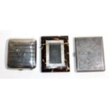 A silver cigarette case, Birmingham 1917, with striped decoration and monogram; a Middle Eastern
