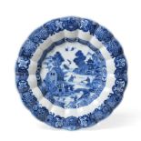 A Chinese Porcelain Dish, Qianlong, of fluted circular form, painted in underglaze blue with a