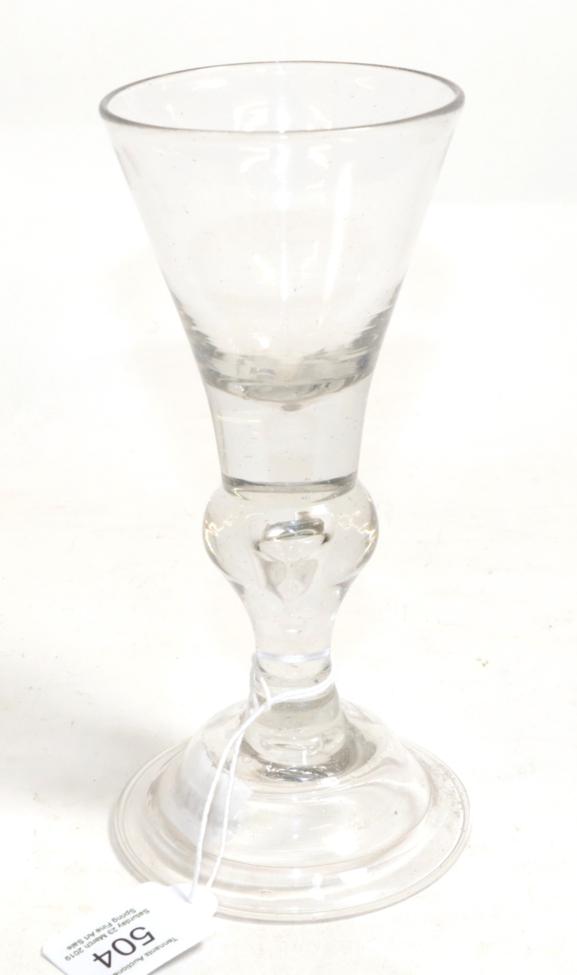 A Baluster Wine Glass, circa 1730, the conical bowl on a baluster stem with air tear and domed