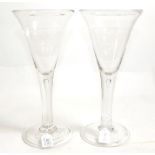 ~ A Pair of Glass Goblets, mid-18th century, the conical bowls on plain stems with air tears, on