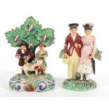 A Staffordshire Pearlware Figure Group of The Dandies, circa 1820, the fashionable couple arm-in-arm