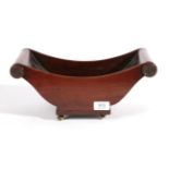 ^ A Mahogany Cheese Coaster, early 19th century, of boat shape with scrolled handles above a