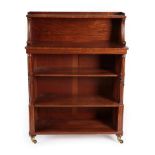 ^ A Regency Mahogany Open Bookcase, circa 1820/1830, the upper section with fluted scrolled