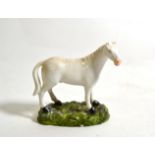 A Derby Porcelain Model of a Horse, circa 1820, naturalistically modelled standing four square on