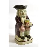 A Pearlware Miniature Toby Jug, circa 1800, traditionally modelled seated wearing a tricorn hat