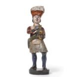 A Carved and Painted Wood Tobacconist Advertising Figure, 19th century, modelled as a Highlander