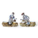 A Pair of Dutch Delft Figural Salts, late 18th/early 19th century, as a man and woman in brightly