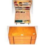 A collection of fly-tying equipment and accessories, contained in a fitted plywood and pine cabinet,