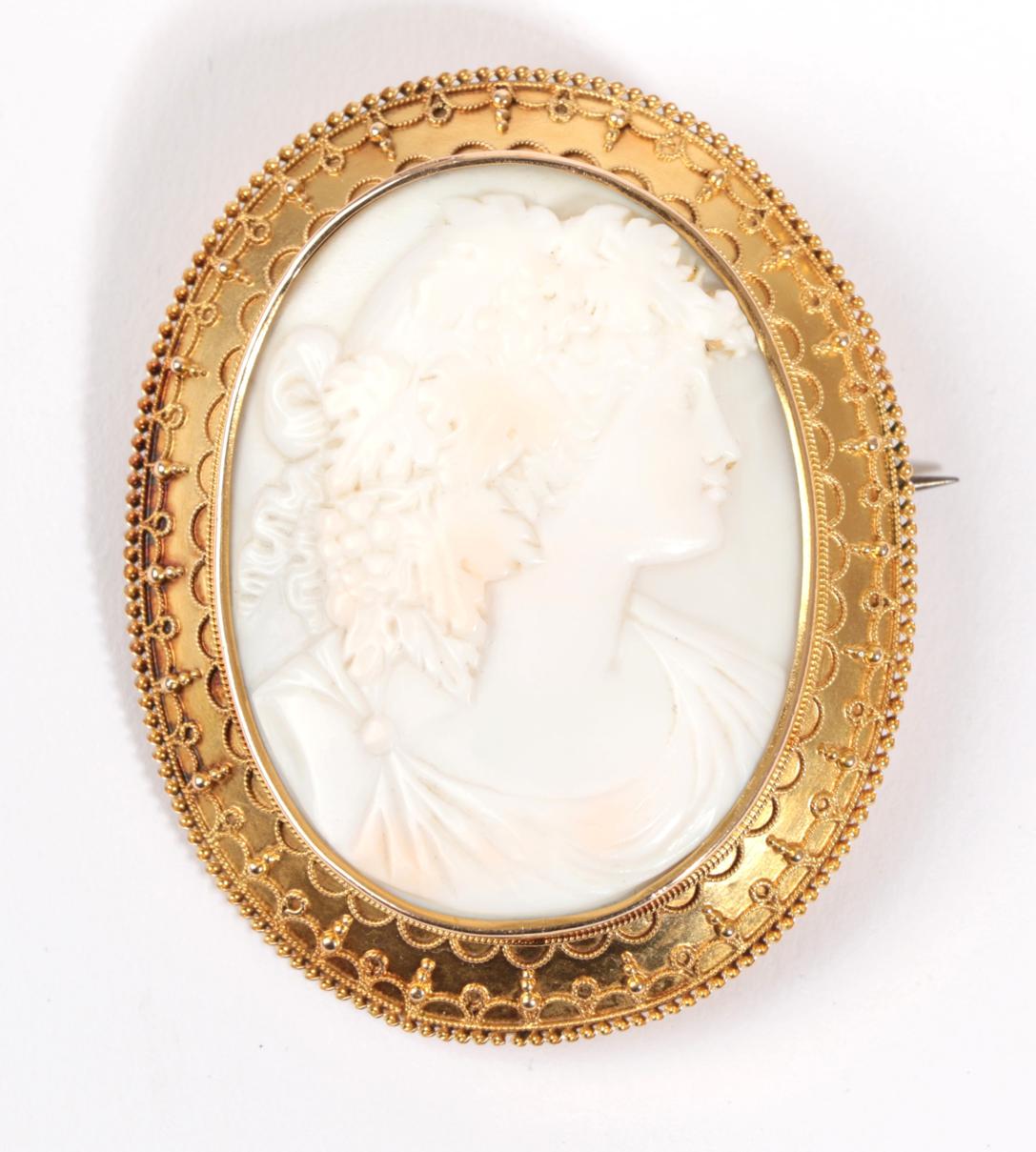 A Cameo Brooch, depicting Bacchus, within an oval bead and decorated rope work frame, circa 1880,