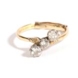 A Diamond Three Stone Ring, an old cut diamond flanked by two larger old cut diamonds, in a twist