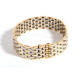 {} A Cartier 'Maillon Panthére' Bracelet, of two colour brick links, length 18cm, width 2cm . The