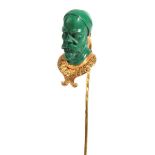 A Malachite Stick Pin, the malachite carved as the head of a bearded gentleman, over a collar.