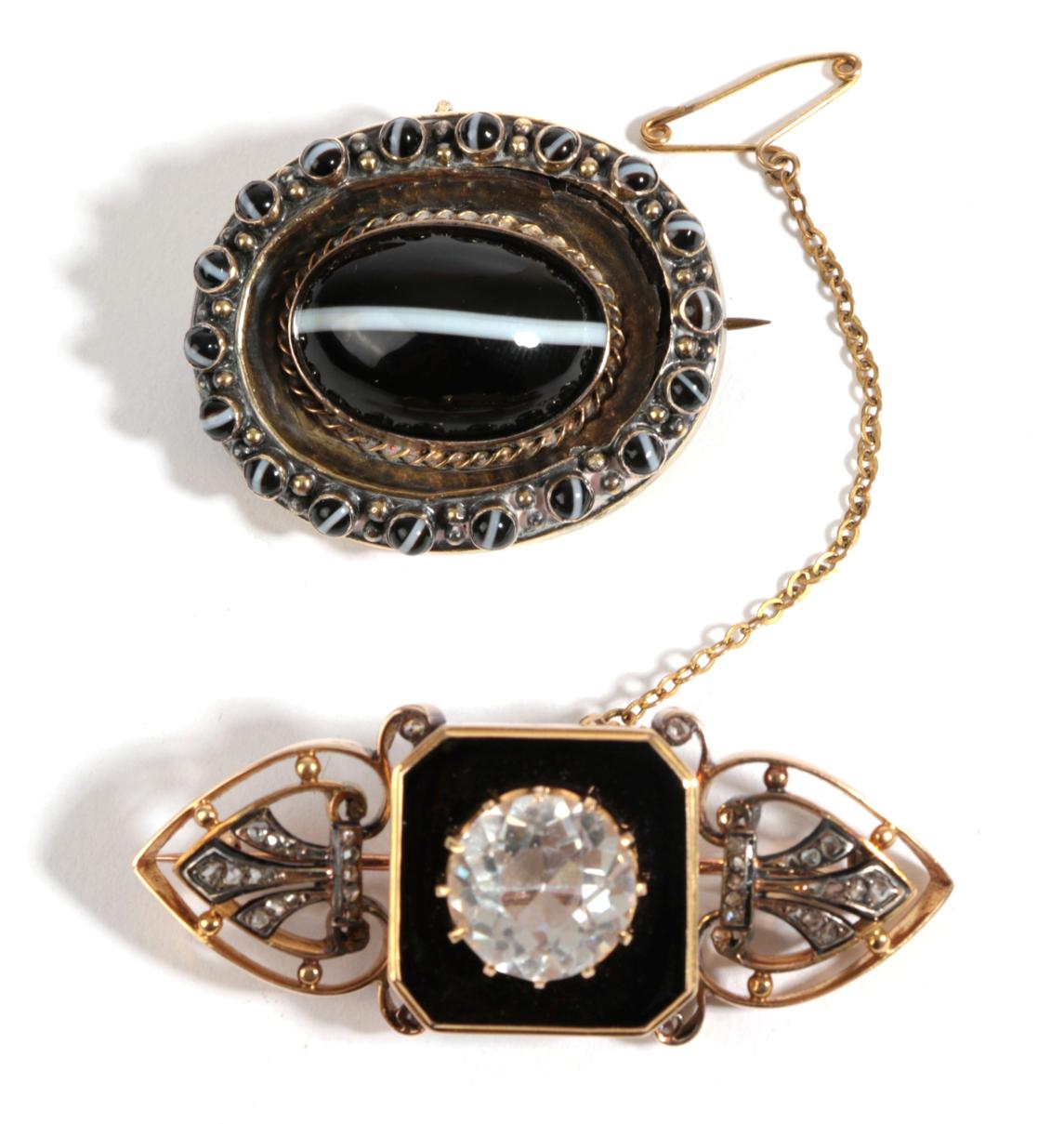 A Diamond and White Stone Set Mourning Brooch, a round white paste stone over a black enamel