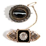 A Diamond and White Stone Set Mourning Brooch, a round white paste stone over a black enamel