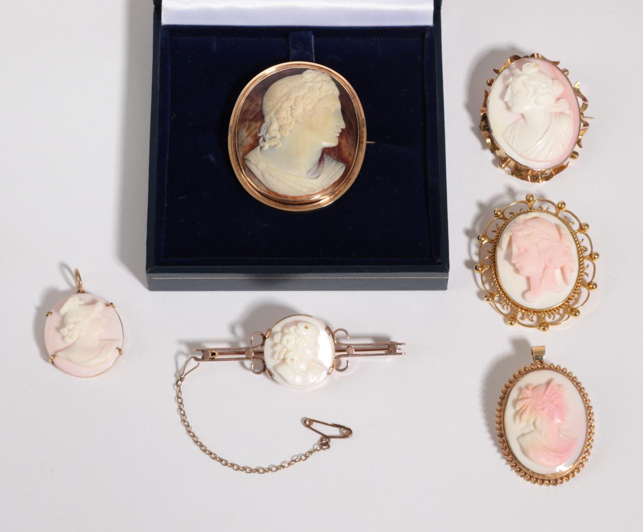 Five Cameo Brooches, one depicting Apollo in an oval frame, measures 4.2cm by 5.2cm, four other