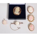 Five Cameo Brooches, one depicting Apollo in an oval frame, measures 4.2cm by 5.2cm, four other