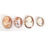 Four Cameo Brooches; one depicting a maiden laying flowers on a pillar, in a simple oval frame,