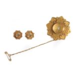 A Victorian 15 Carat Gold Brooch and Earring Set, the brooch with a central old cut diamond within a