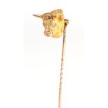 A Bull's Head Stick Pin, with old cut diamond eyes . Good condition. Stamped '9CT'. Gross weight 9.7