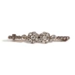 A Diamond Set Bar Brooch, comprised of two old cut diamond cluster set side-by-side, to a row of old