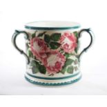 A Wemyss Pottery Tyg, circa 1900, of cylindrical form, typically painted with pink roses within
