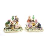 A Pair of Derby Style Porcelain Figure Groups, late 19th/early 20th century, as children playing