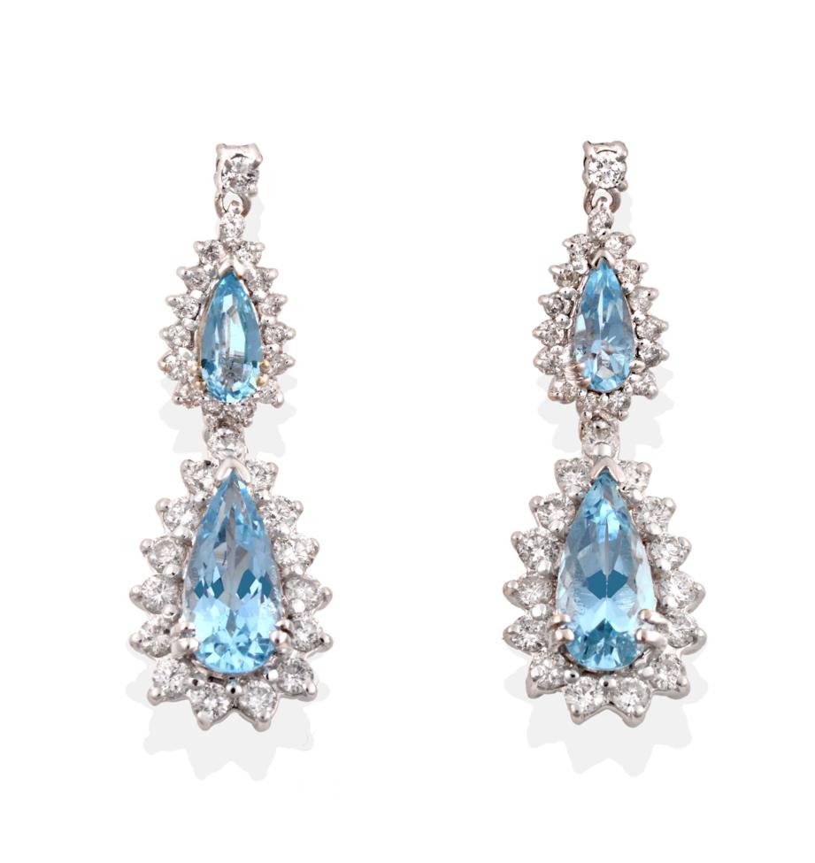 A Pair of 18 Carat White Gold Aquamarine and Diamond Drop Earrings, a round brilliant cut diamond