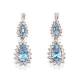 A Pair of 18 Carat White Gold Aquamarine and Diamond Drop Earrings, a round brilliant cut diamond