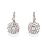 A Pair of Diamond Drop Cluster Earrings, an old cut diamond in a millegrain setting suspends a
