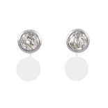 A Pair of 18 Carat White Gold Diamond Solitaire Earrings, the old cut diamonds in rubbed over