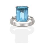 A Platinum Aquamarine and Diamond Ring, the octagonal-cut aquamarine in a corner claw setting, to