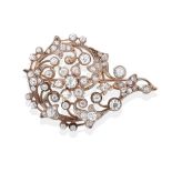 A Late 19th Century Diamond Brooch, old cut diamonds create a floral centre within a swirling