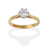 An 18 Carat Gold Diamond Solitaire Ring, the round brilliant cut diamond in a white six claw setting