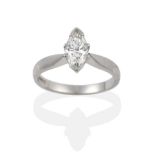 A Platinum Diamond Solitaire Ring, the marquise cut diamond in a white claw setting, to a tapered
