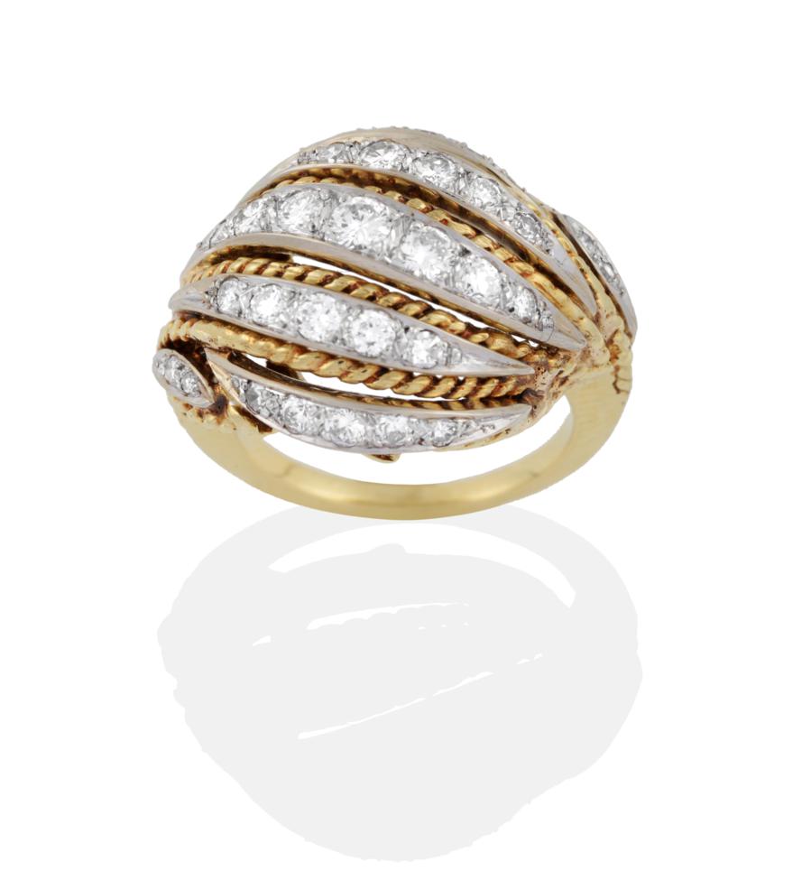 A Fancy Diamond Ring, comprised of rows of graduated round brilliant cut diamonds diagonally set