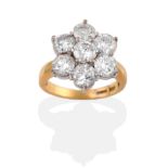 An 18 Carat Gold Diamond Cluster Ring, seven round brilliant cut diamonds in white claw settings, to