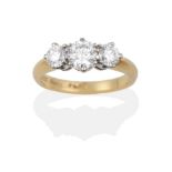 An 18 Carat Gold Diamond Three Stone Ring, the round brilliant cut diamonds in white claws on a