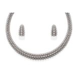 A ''Grains de Raisins'' Necklace and Earring Suite, by Boucheron, comprising three rows of graduated